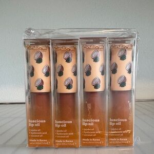 #28 4 THE CREME SHOP COCONUT JELLY LIP OILS